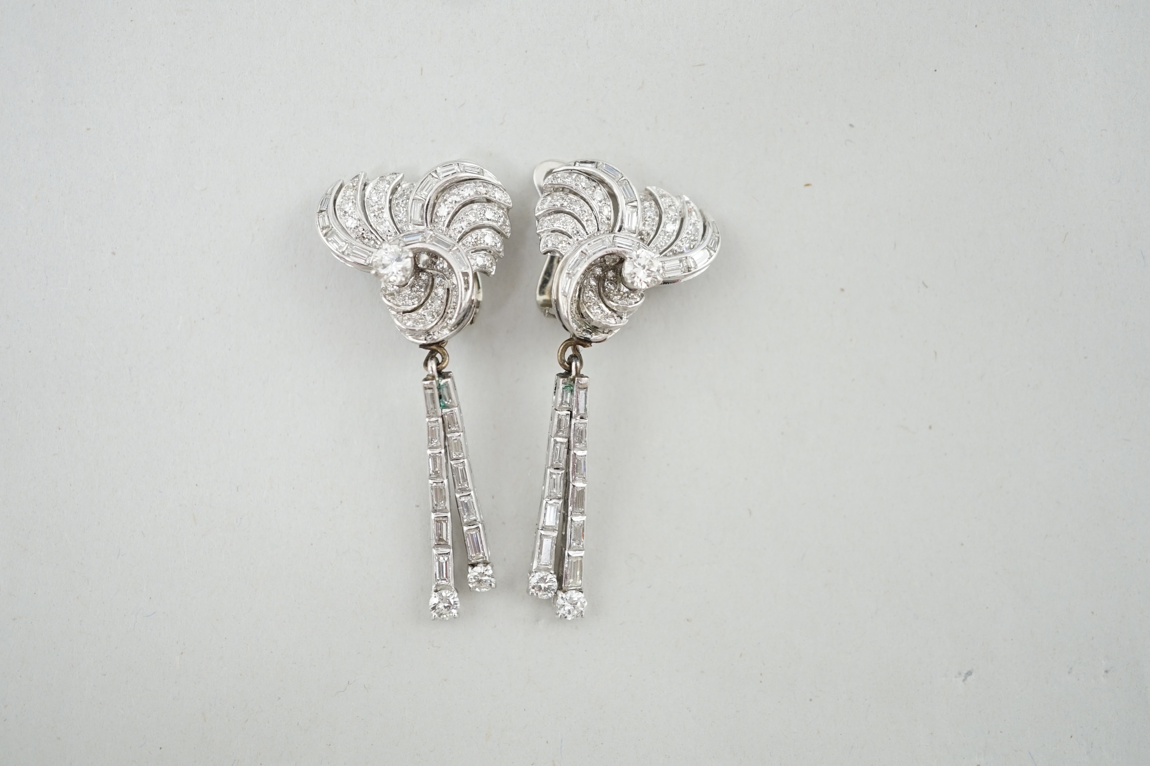 A pair of 1960's white gold and diamond cluster set drop ear clips